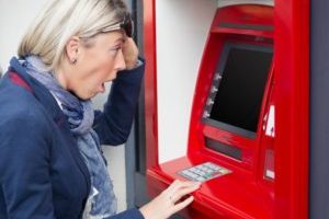 32373128 – shocked woman looking at her account balance